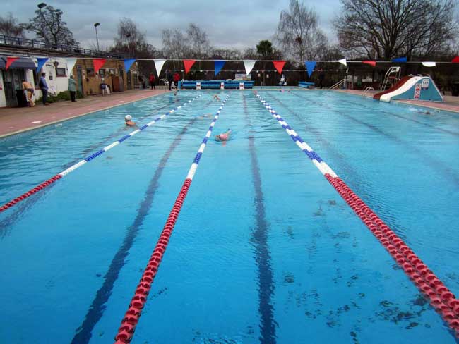 Brockwell Lido Swimmers in the warm waters of Hampton Lido